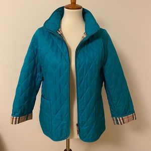 Burberry teal blue xl jacket with signature print.